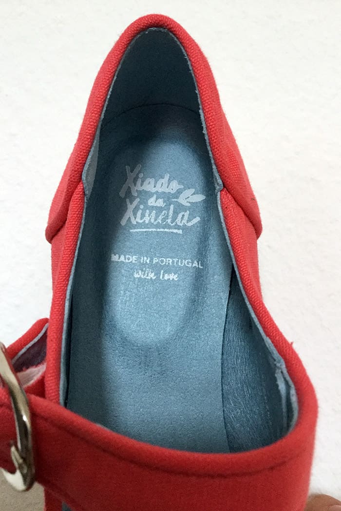 bright pink shoes in white background. Blue sole with logo and "Made in Portugal with love" stamped on.